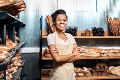 Happy Bread Shop Business Owner Stands with Arms Folded